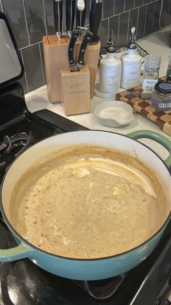 melting boursin cheese into creamy sauce