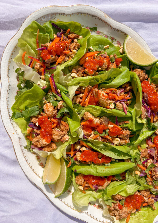Thai chicken lettuce wraps with peanut flavor, ground chicken, fresh herbs, and lime