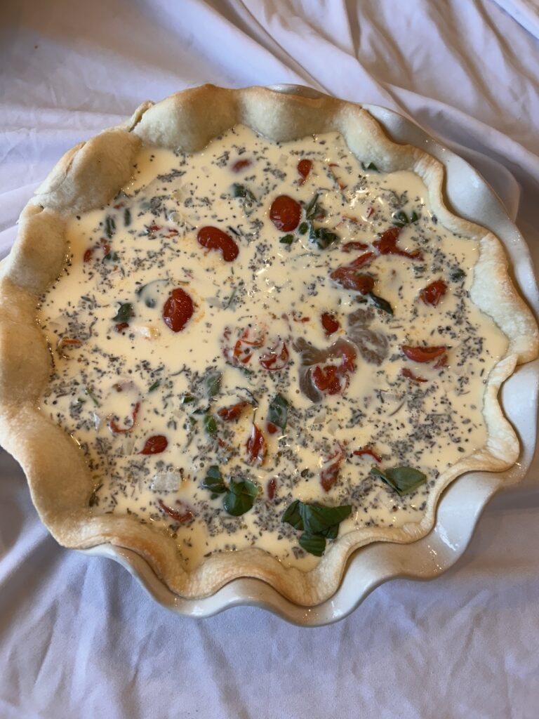 Unbaked caprese quiche before baking