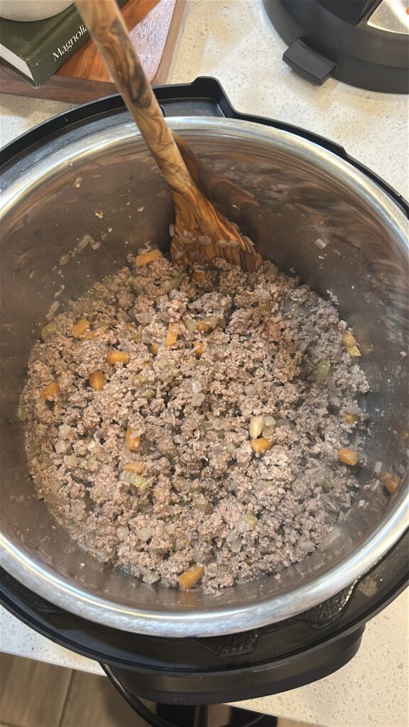 Ground beef browning in the Instant Pot for homemade Bolognese sauce