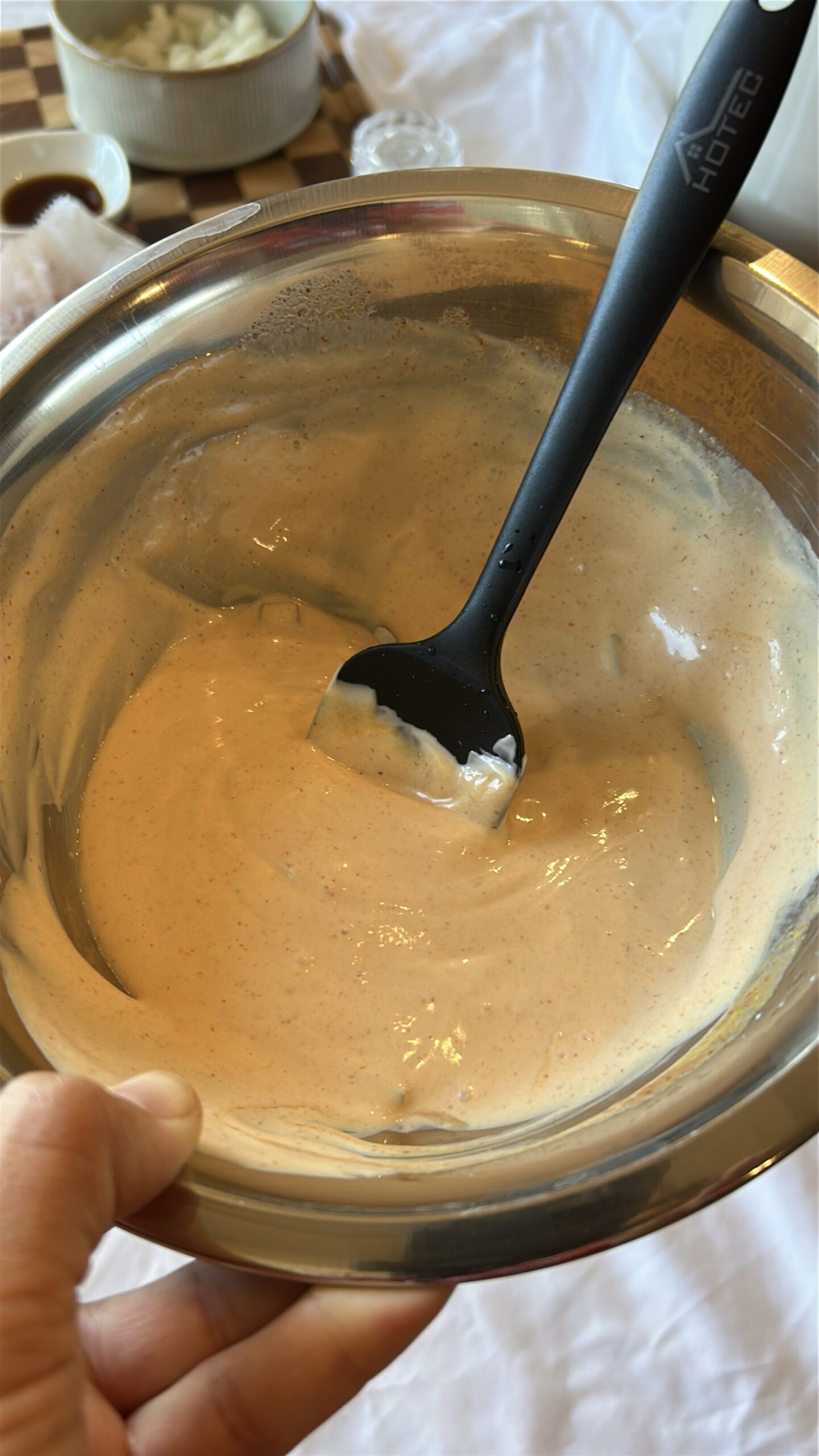 Homemade burger sauce being whisked for cheeseburger bowls
