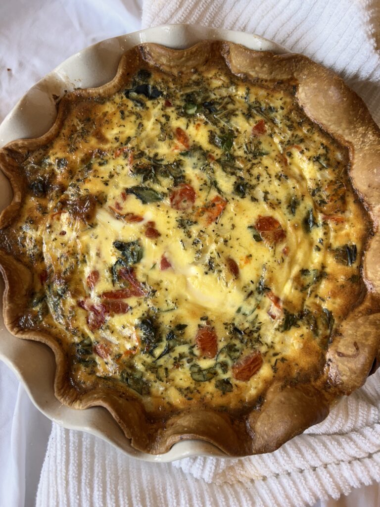 Freshly baked caprese quiche cooling after baking