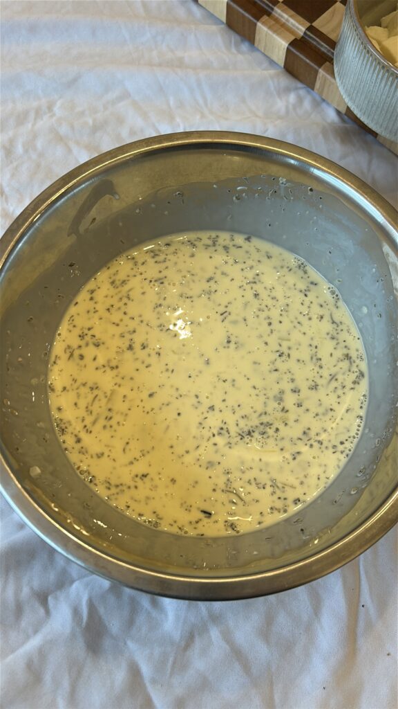 Whisking custard mixture for caprese quiche