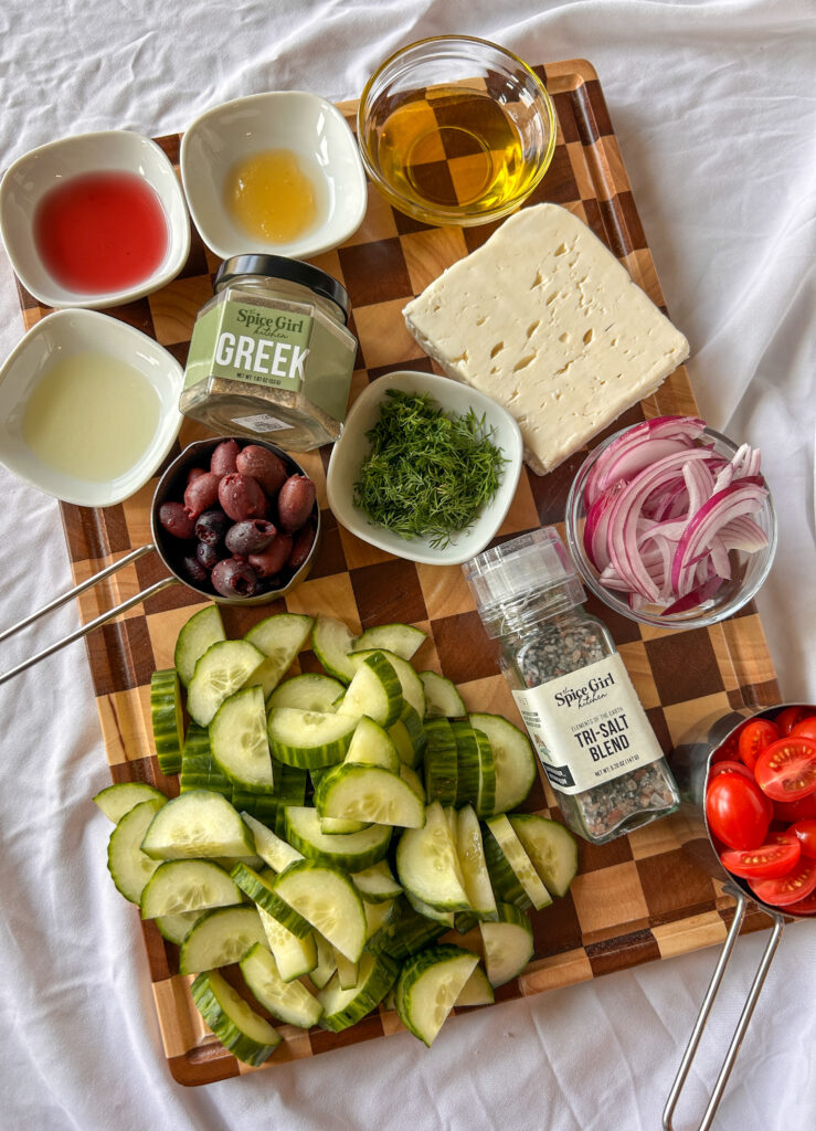 Ingredients for Greek cucumber salad with feta and Mediterranean dressing