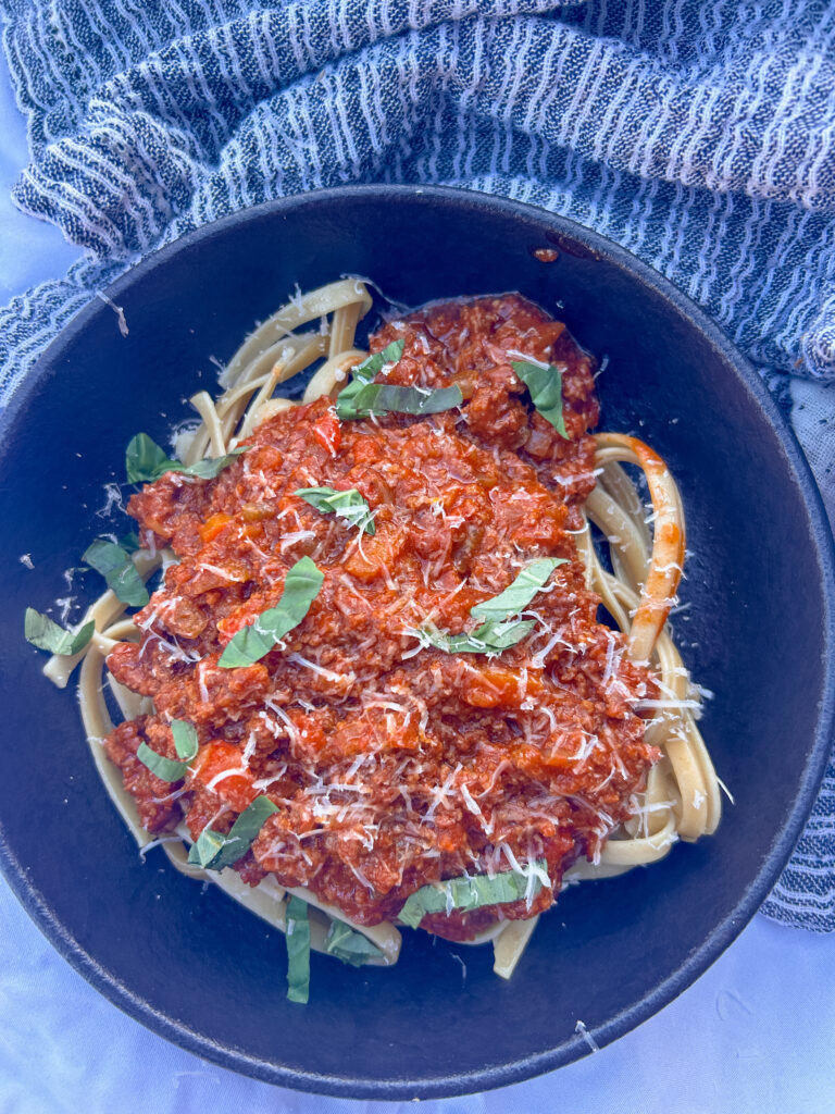 Close-up of tagliatelle pasta coated in rich Instant Pot Bolognese sauce