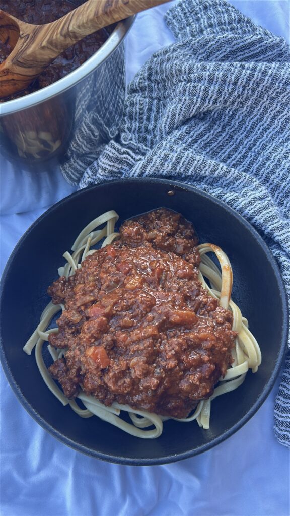 Instant Pot Bolognese sauce simmering to thicken after pressure cooking