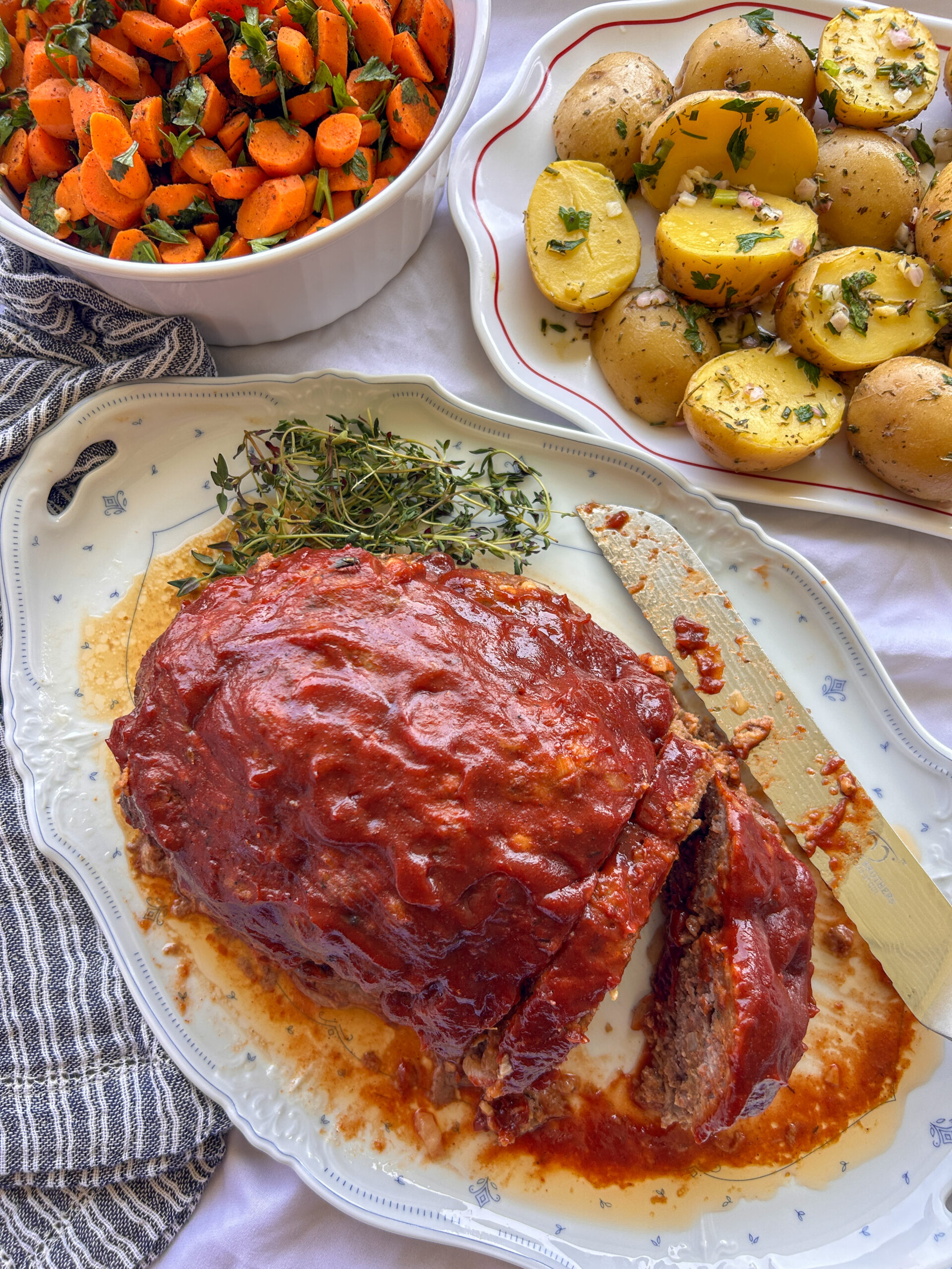Crockpot meatloaf with a sweet and tangy glaze sliced and ready to serve