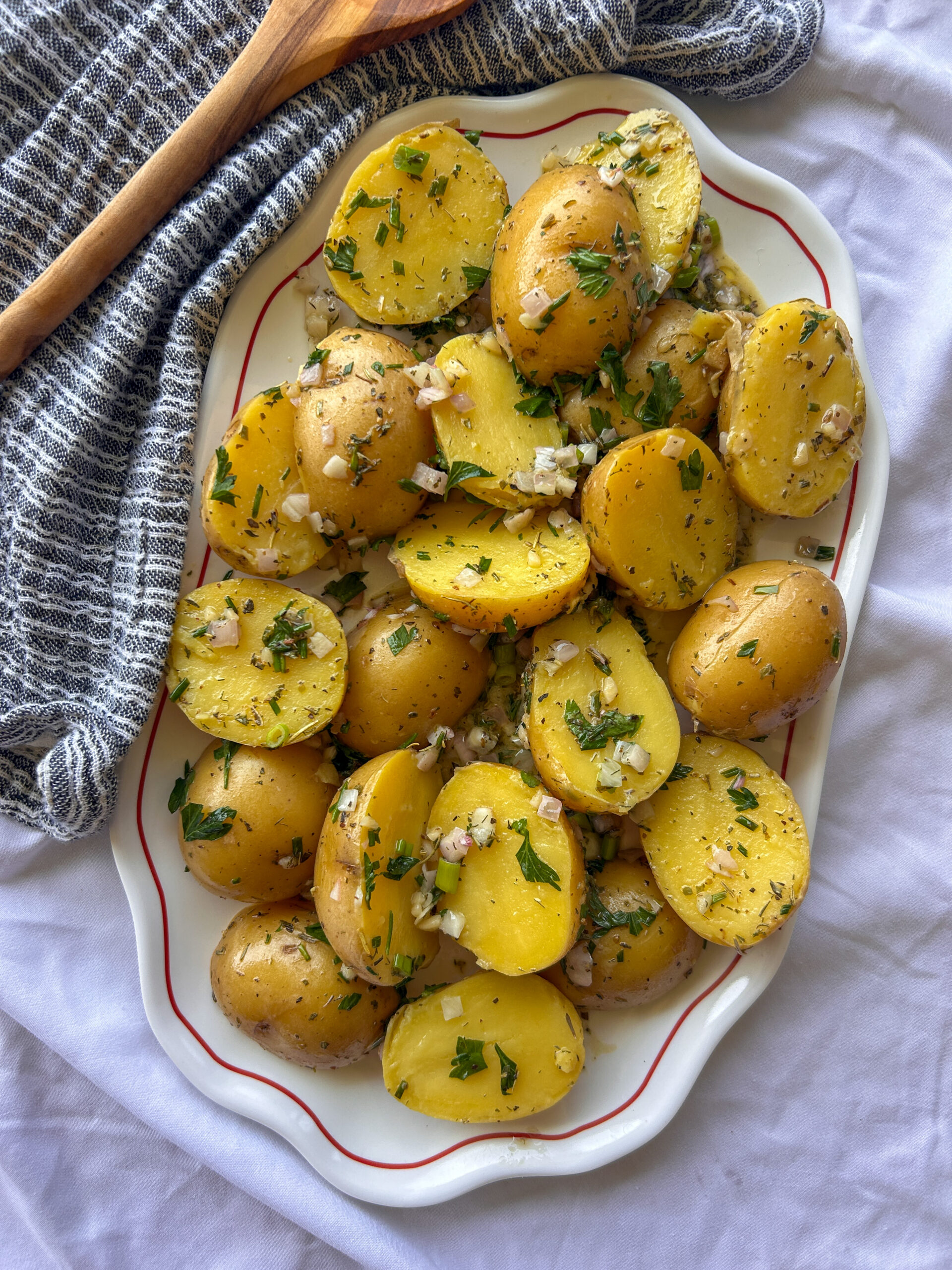 French potato salad with Dijon vinaigrette, fresh herbs, shallots, and Herbes de Provence