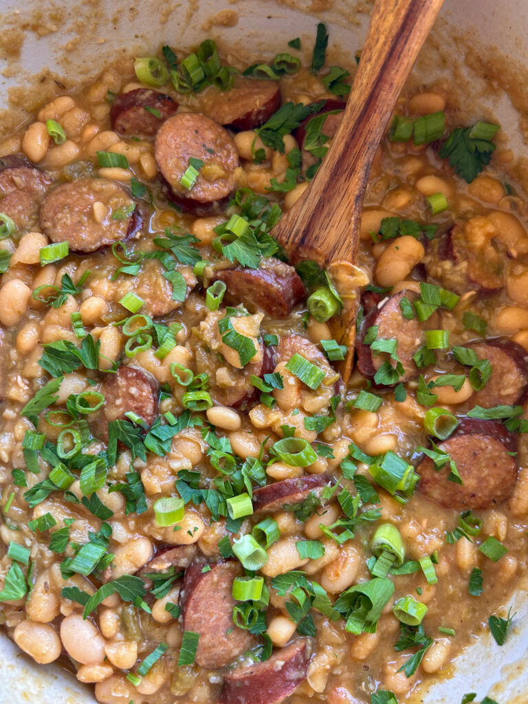 White beans and sausage finished with fresh parsley and green onions
