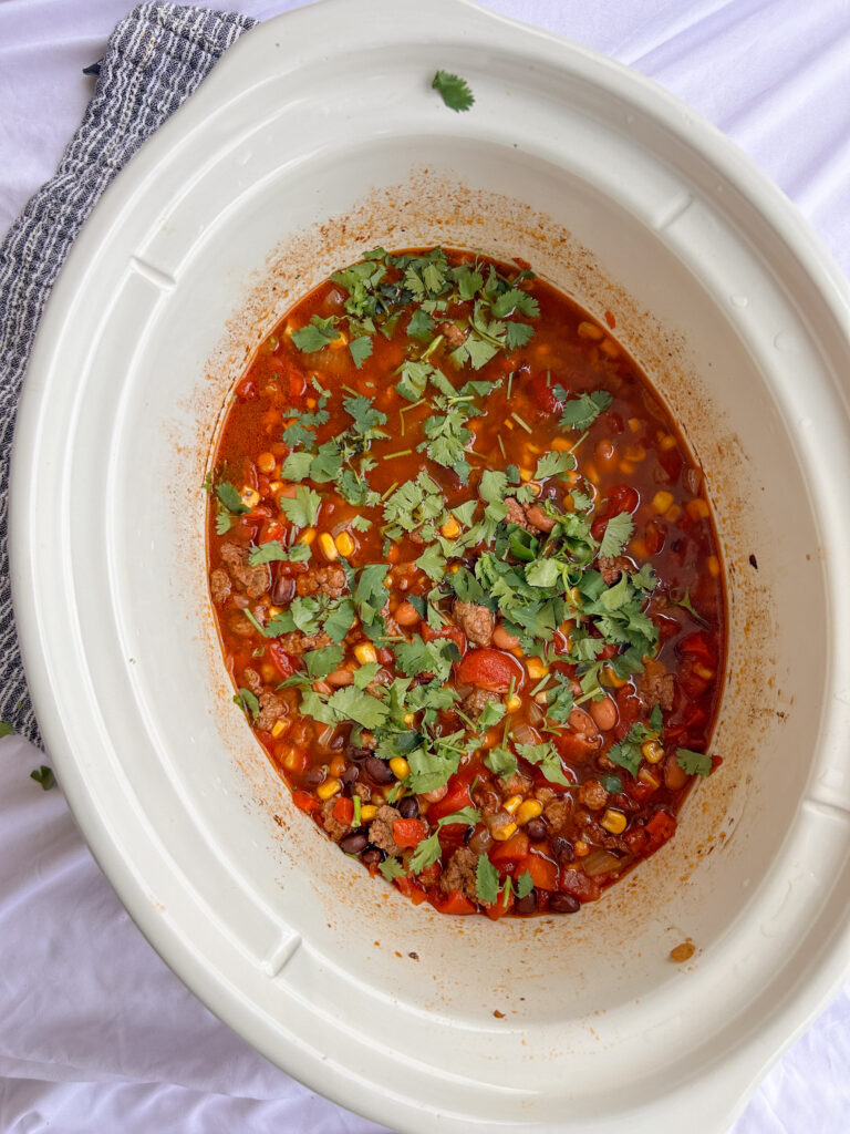 Slow cooker taco soup garnished