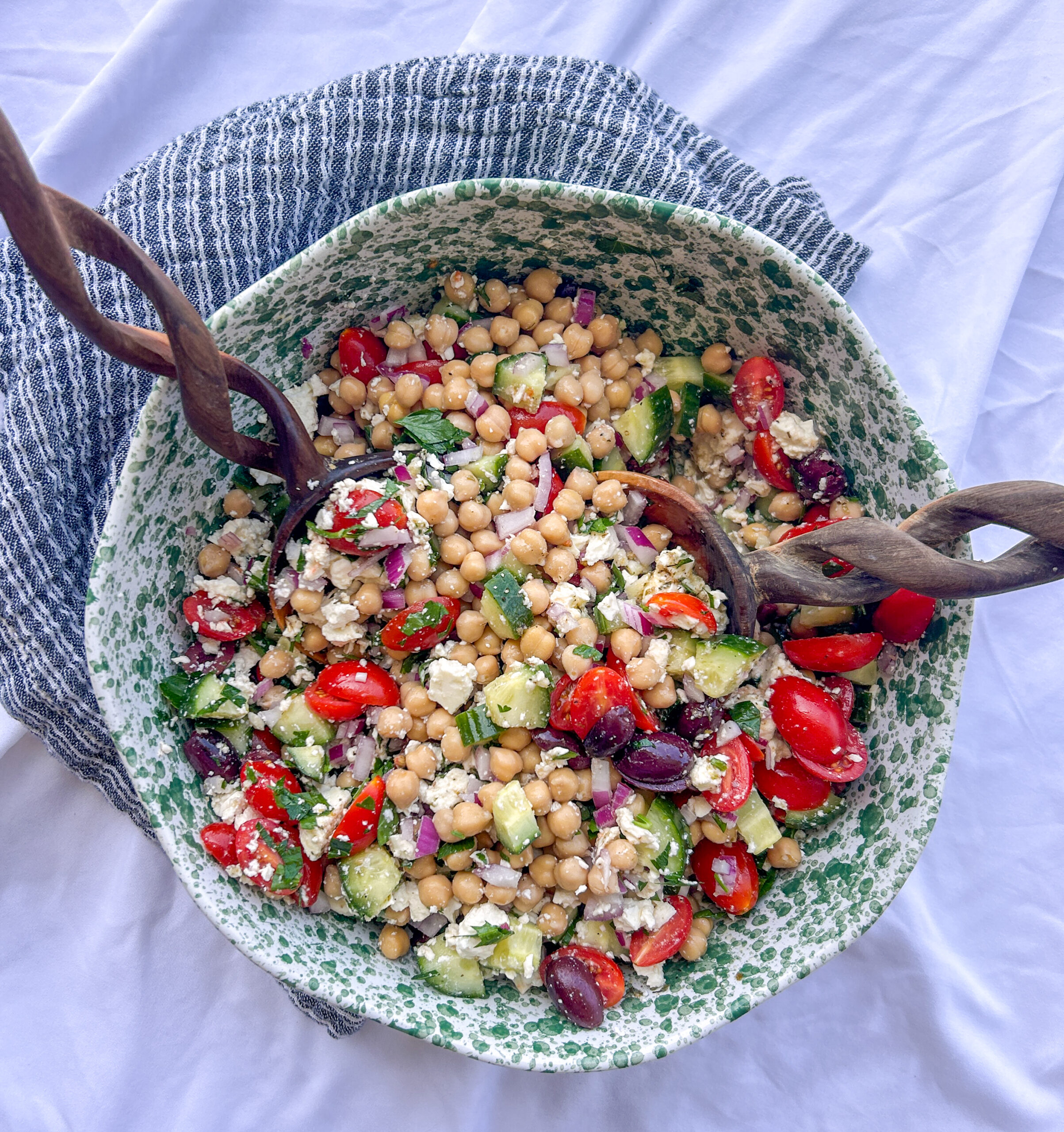 Greek chickpea feta salad with cucumber, tomatoes, feta cheese, Kalamata olives, and Greek vinaigrette