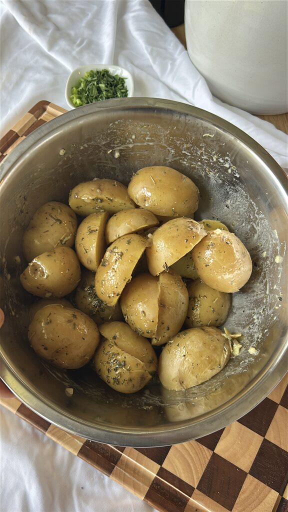 Warm potatoes tossed with Dijon vinaigrette for French potato salad