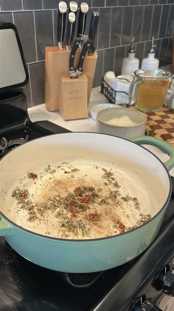 Shallot, garlic, tomato paste, and Italian seasoning sautéing in butter for Marry Me Tortellini