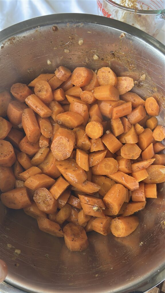 Cooked carrots tossed with lemon garlic dressing and Moroccan spices