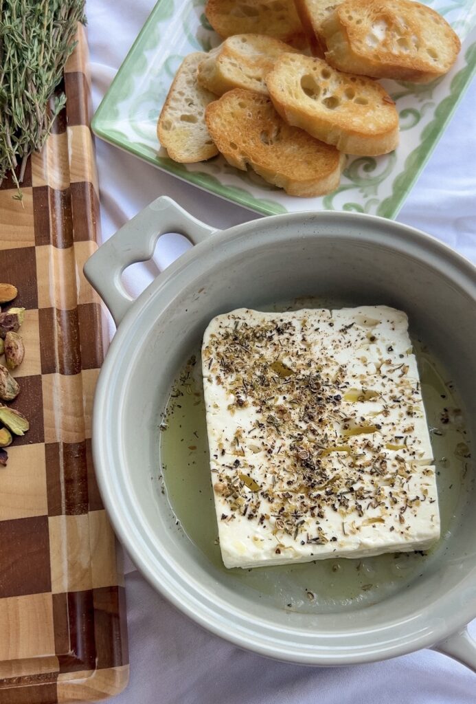 Feta baking in the oven until warm and creamy.