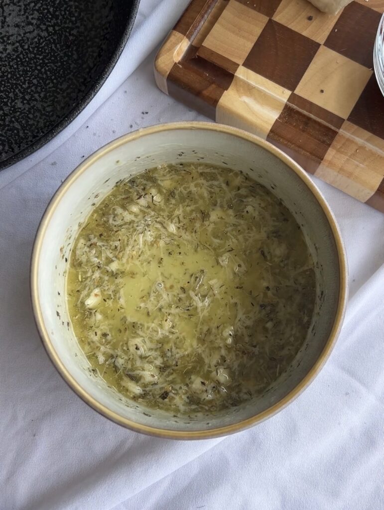 Italian garlic butter made with melted butter, garlic, Parmesan, parsley, and The Spice Girl Kitchen Italian Seasoning.