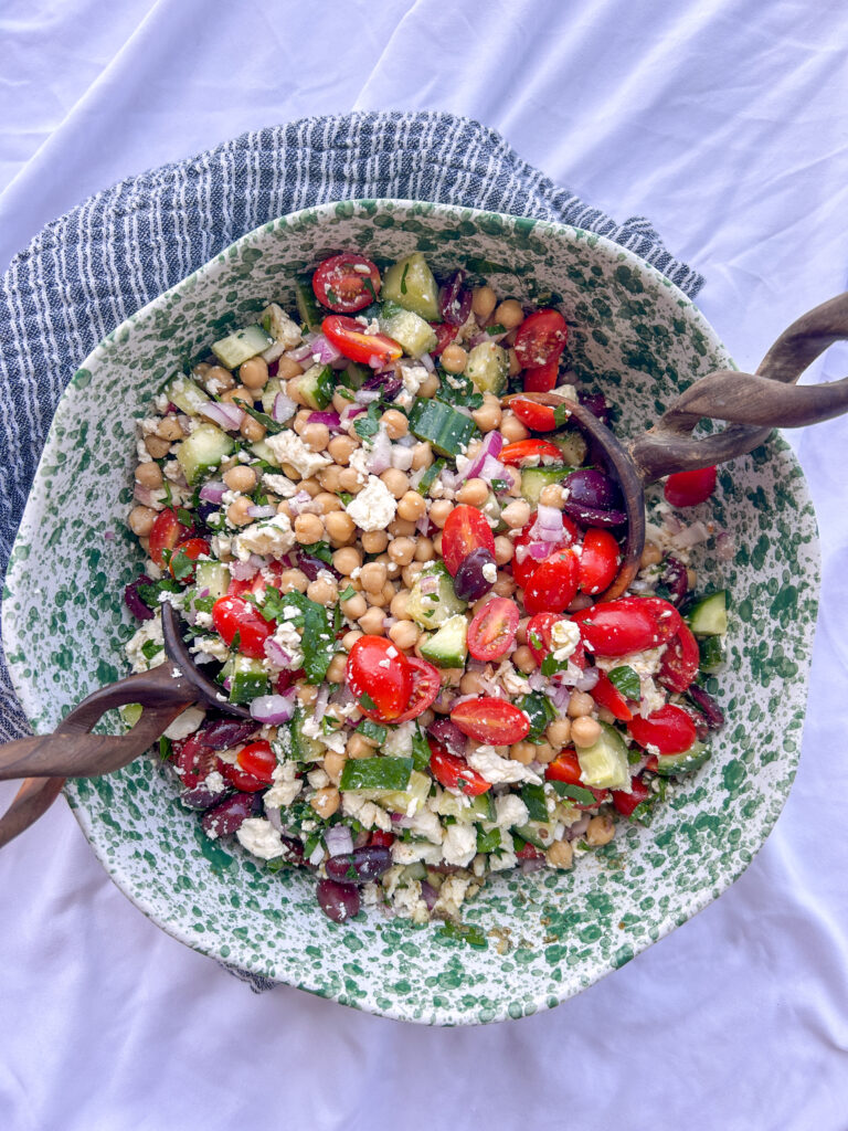 Greek chickpea feta salad resting so the chickpeas absorb the lemon vinaigrette before serving