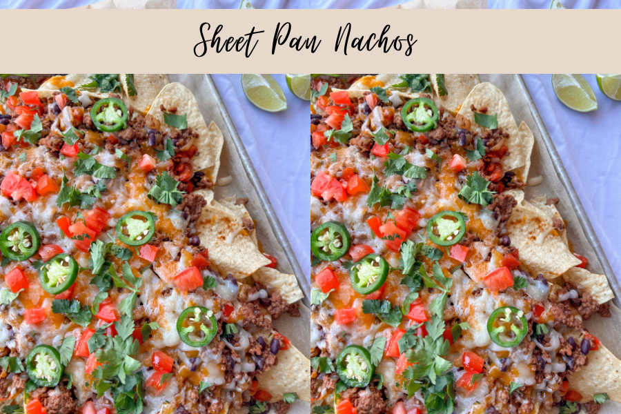 Sheet pan nachos loaded with seasoned ground beef, black beans, cheddar cheese, Monterey Jack cheese, and fresh toppings on a baking sheet
