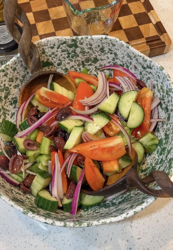 Fresh vegetables tossed with homemade dressing for Traditional Greek Salad