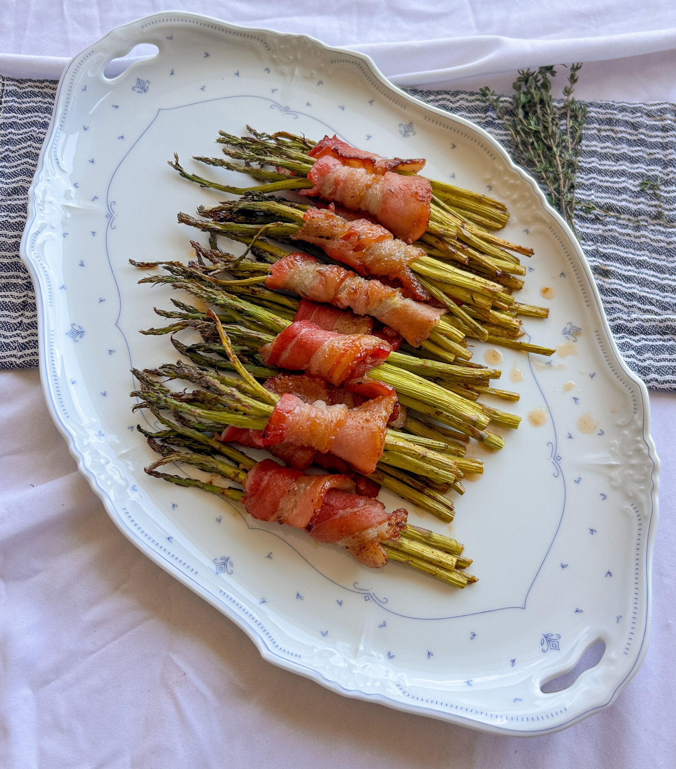 Bacon wrapped asparagus with crispy caramelized bacon, Okie Rub and hot honey