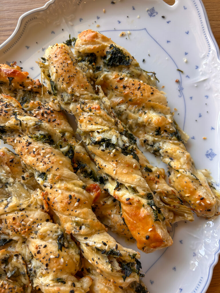 Baked spinach artichoke puff pastry twists golden brown and crisp