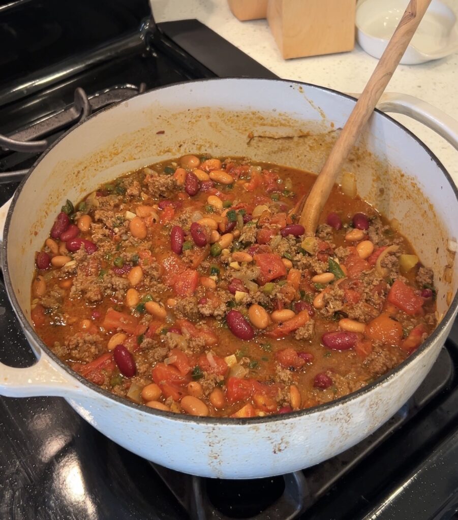 Fire-roasted tomatoes, kidney beans, pinto beans, and beef broth added to spicy bison chili