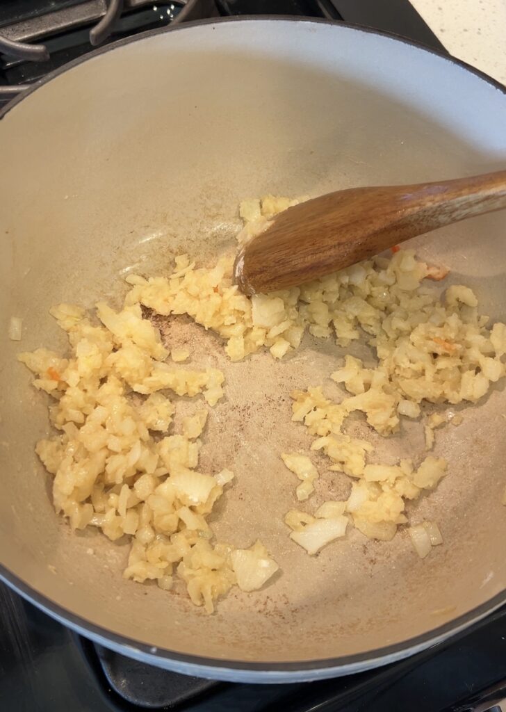 Flour stirred into butter and sautéed onions to make a roux for broccoli cheddar soup