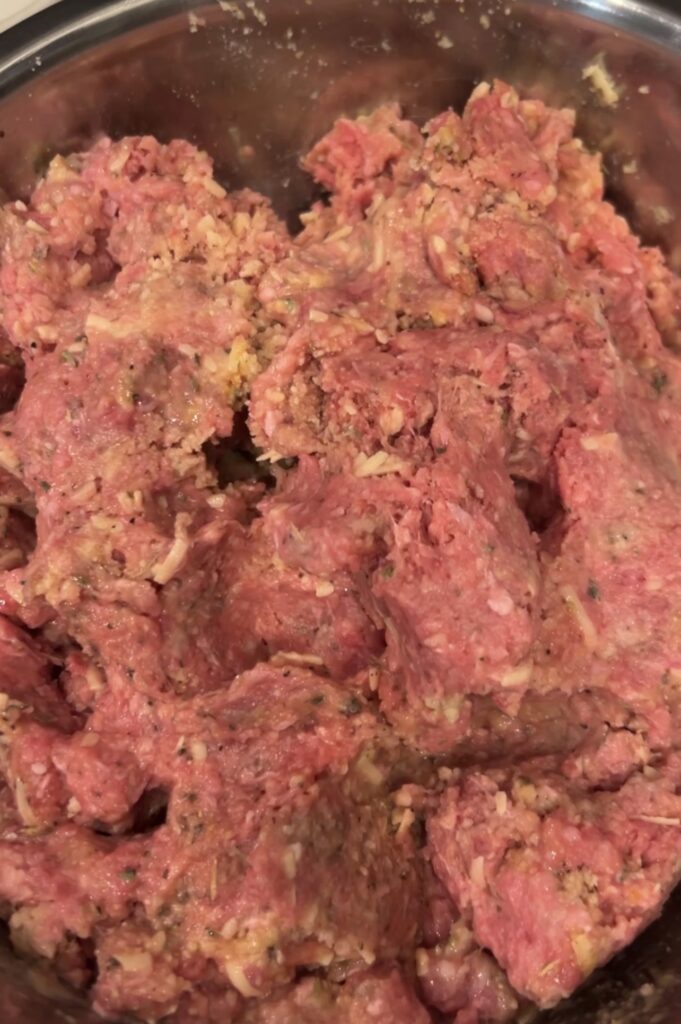Ground beef mixture with caramelized onions, Gruyère cheese, breadcrumbs, and seasonings
