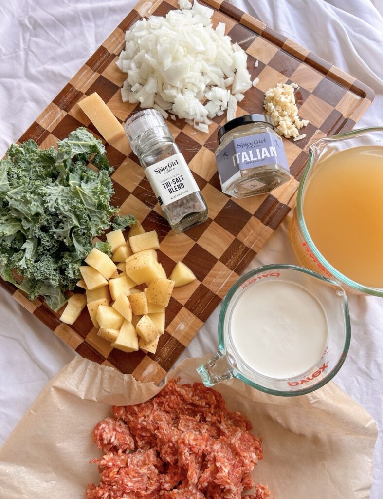 Ingredients for Olive Garden Zuppa Toscana including Italian sausage, potatoes, kale, cream, and seasonings