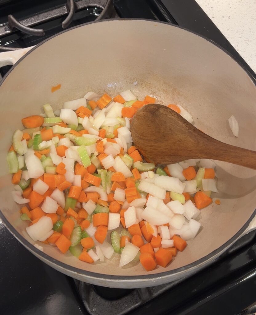 Onion carrot and celery sautéing for butternut squash soup