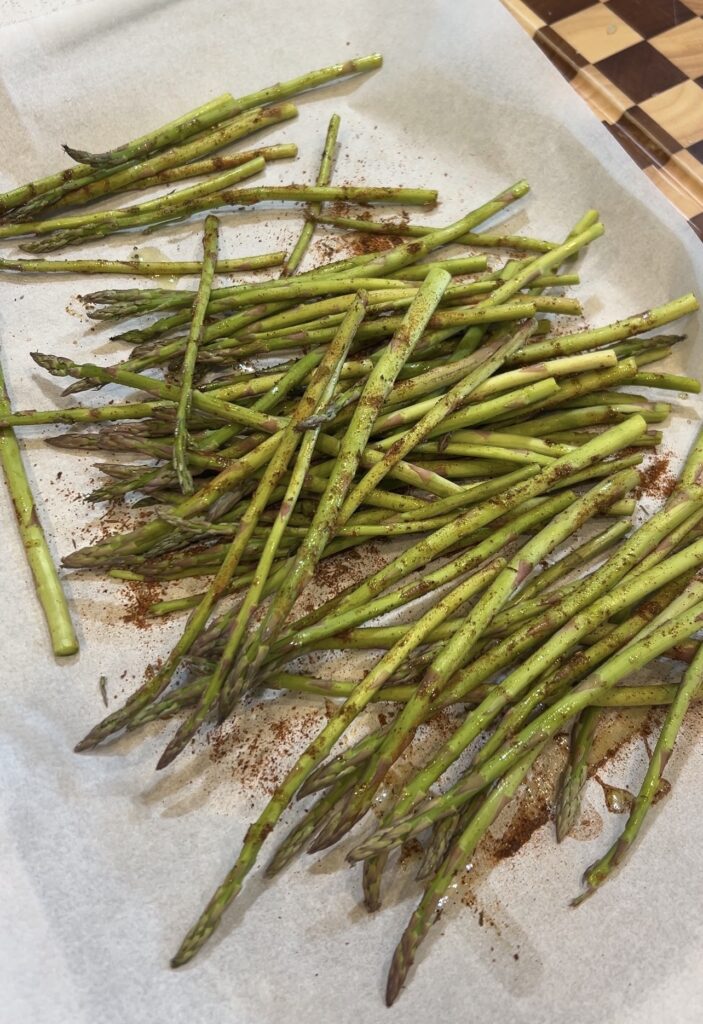 Fresh asparagus seasoned with olive oil, salt and Okie Rub before wrapping with bacon