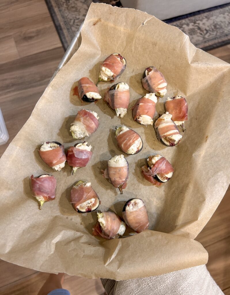 Baked prosciutto wrapped figs with softened Boursin cheese and lightly crisp prosciutto.