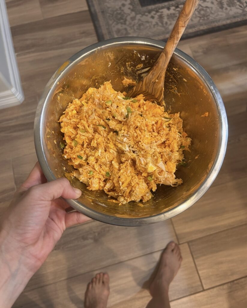 Shredded chicken mixed with buffalo sauce, cream cheese, cheddar, Monterey Jack, and seasonings.