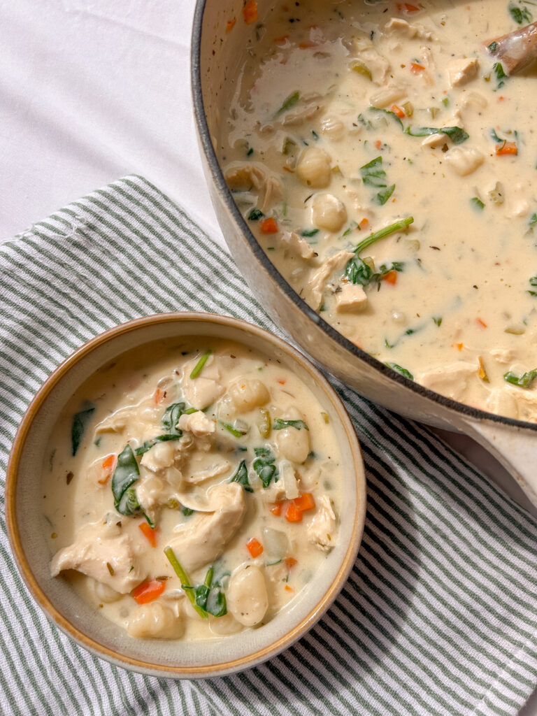 Creamy chicken gnocchi soup with chicken breast, potato gnocchi, carrots, and spinach