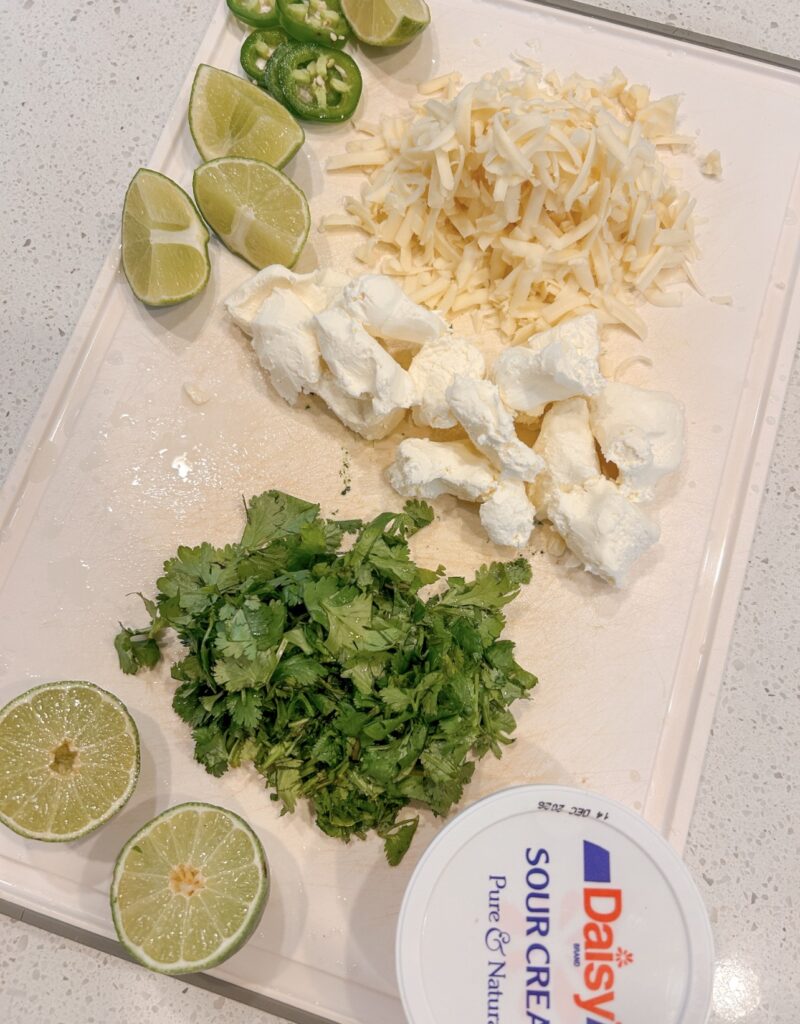 Cream cheese, sour cream, Monterey Jack, lime, and cilantro for the creamy soup finish.